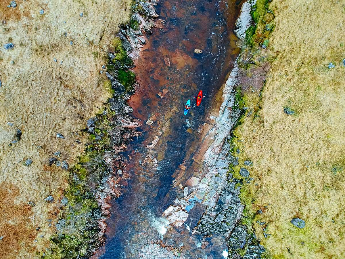 glen etive aerial photography of two person's riding on kayak on river at daytime ballachulish